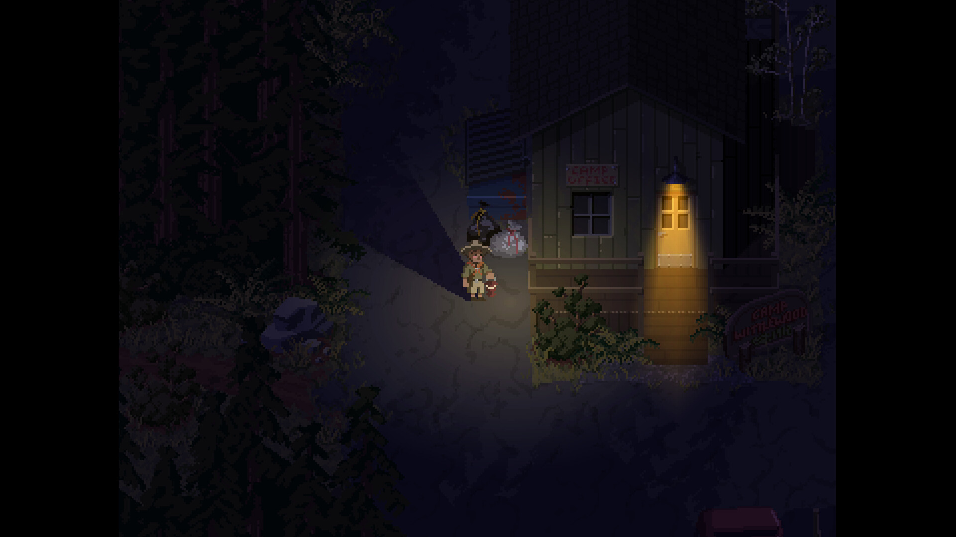 A lit path by the camp cabins, official screenshot